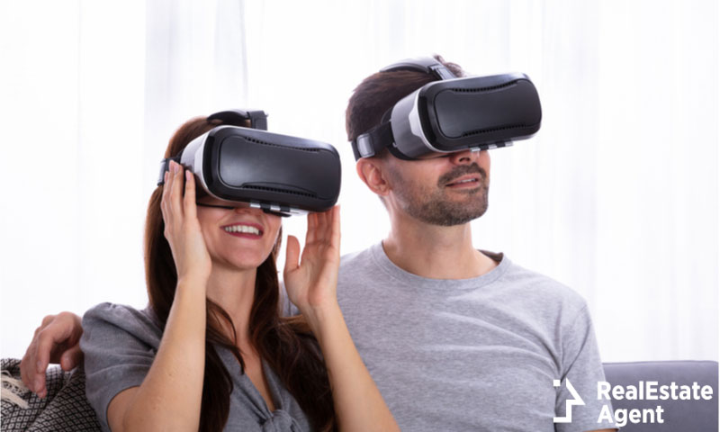 young couple sitting on sofa experiencing virtual