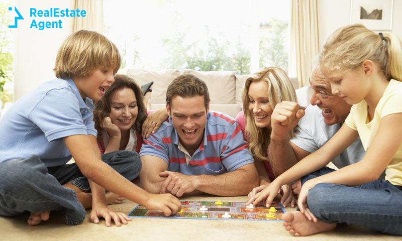 family playing boardgame together