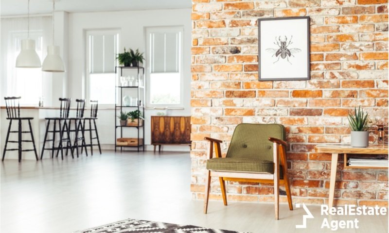 rustic furniture on brick wall