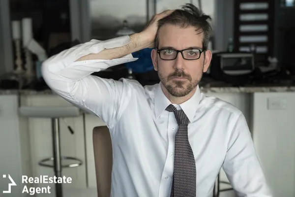 businessman with hand in his head