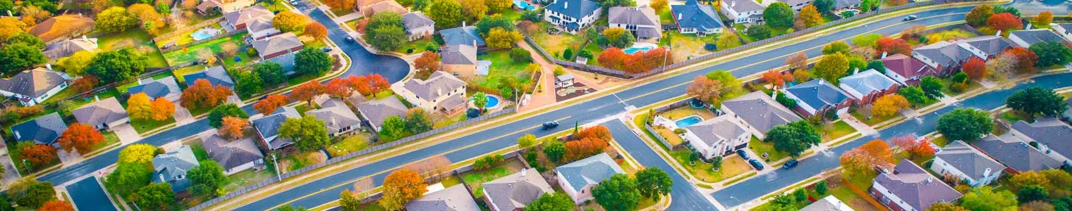 very colorful aerial drone view of a suburb during fall colors