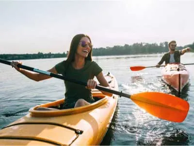 couple kayaking on a beautiful day