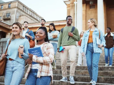 different students walking on university steps