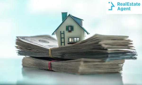 A house on top of a pile of money representing Down Payment