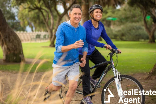 elder couple exercising park