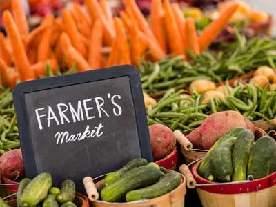 vegetables and a sign with farmers market