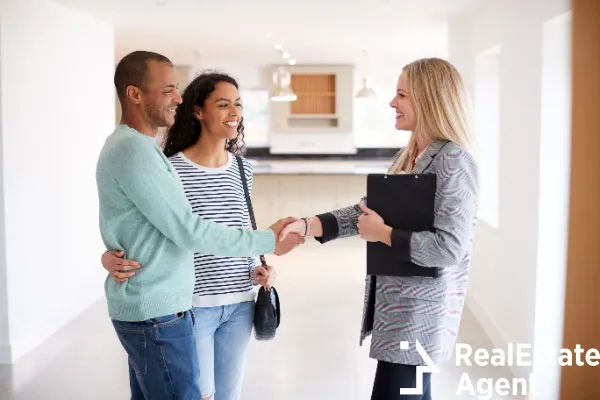 female realtor shaking hands