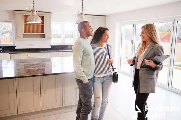 female realtor showing coupe interested in buying