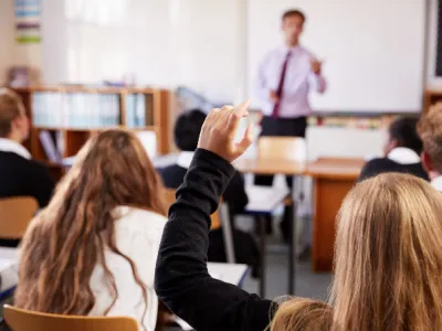 student raising hand ask question