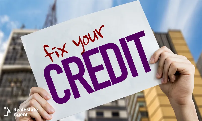 Person holding up a fix your credit sign