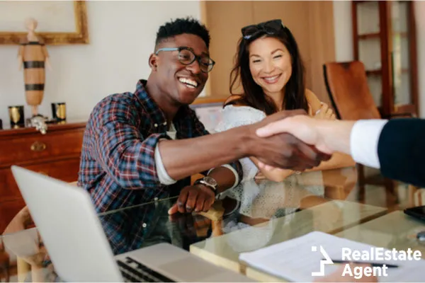 happy property owners shaking their hands