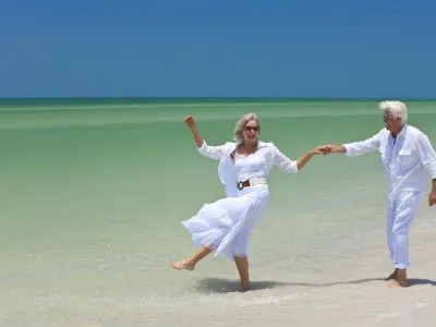 happy senior man woman couple dancing