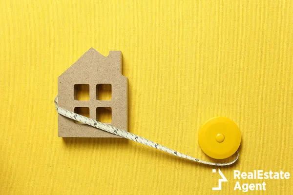 house model tape measure on yellow
