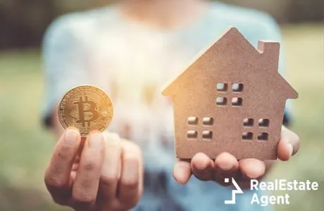 image of a little house and cryptocurrency symbol