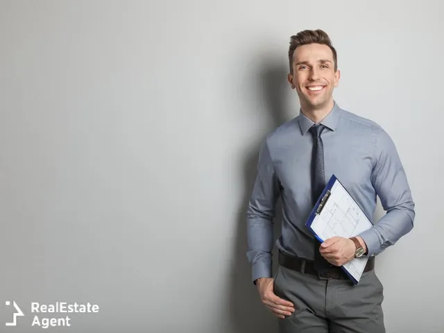 male real estate agent in grey background
