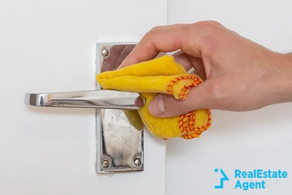 man cleaning a door know