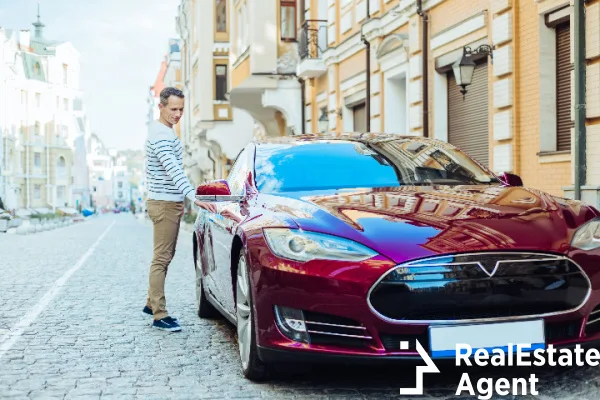 nice good looking man holding car