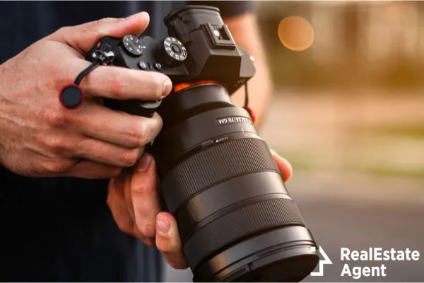 photographer holding dslr camera