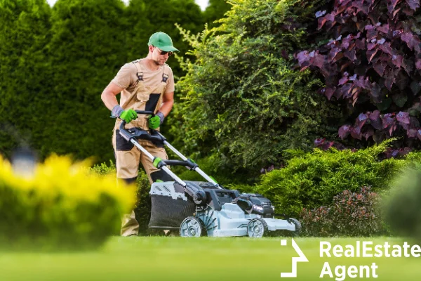 professional gardener moving lawn