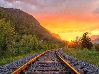 rail tracks setting sun