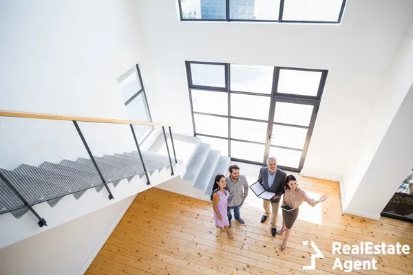 realtors showing a house to a couple