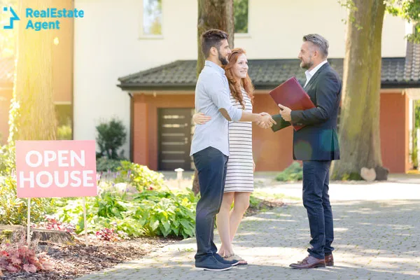 real estate agent meeting homebuyers at an open house