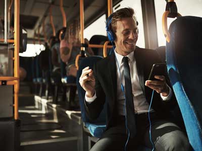 smilling young businessman on bus