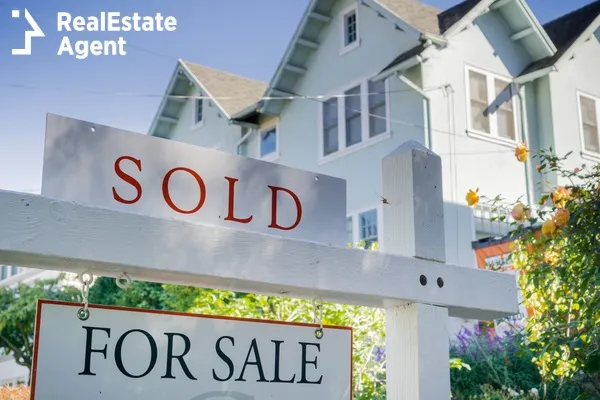 sold sign in front of a house