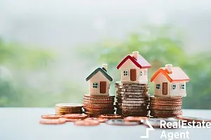 miniature house stack on coins