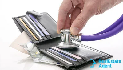 wallet with money and a stetoscope wallet with money and a stetoscope