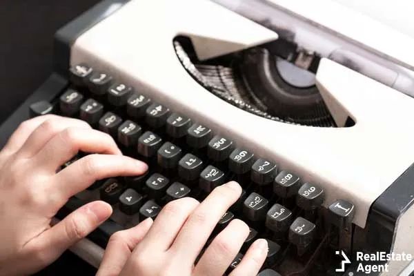 woman typing on an old thai typewriter