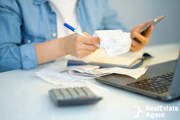 woman using pen writing on bank