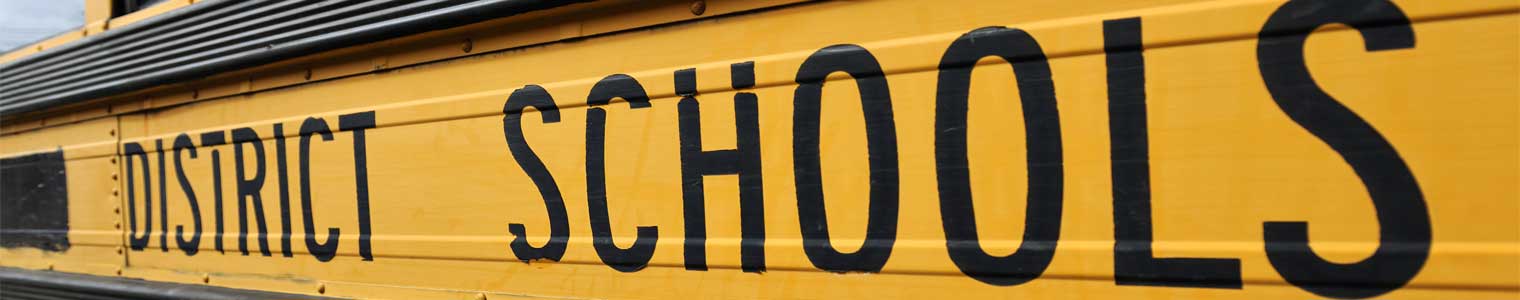 yellow school bus with text district schools