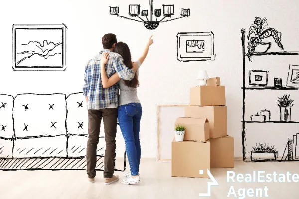 young couple imagining interior of new house