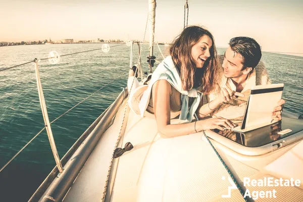 young couple on a sailboat