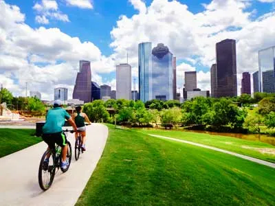 young couple riding bycicle houston texas